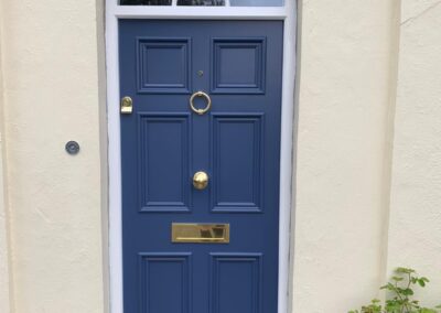 Blue Six Panel Door With Brass Ironmongery